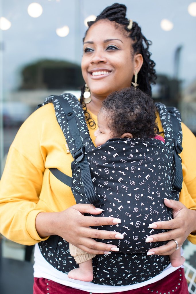 One of the best gifts I ever received during my baby shower was a baby carrier. The convenience of a baby carrier is immeasurable. There are so many benefits to them. Which is why I'd love to help you celebrate the baby coming into your life with this beautiful Tula Free-To-Grow Baby Carrier giveaway in the beautiful Celebrate pattern!